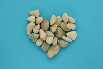Heart-shaped design made from stones, a visual representation of love and nature.