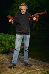 Senior citizen fishing with magnet in city lake found guns