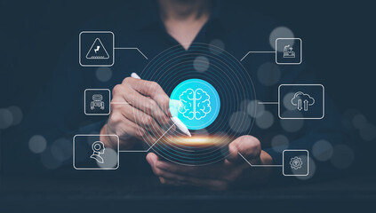 Artificial intelligence and digital transformation concept. Businessman using tablet and stylus with AI brain icon and technology interface for innovation, cloud computing, and automation.