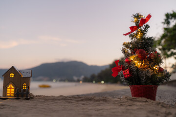 Cute and Christmas Tree House Relaxing on the Beach. Merry Christmas Holiday. Bright Background. Patong Beach, Phuket, Thailand.
