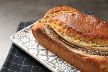 Delicious banana bread on grey table, closeup