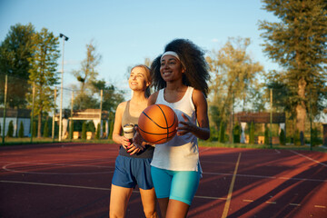 Happy joyful woman sharing impression after basketball game session