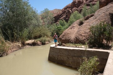 Beautiful scenery of Monkey Fingers trail in the Dades Gorge with silhouettes of hiking people,...