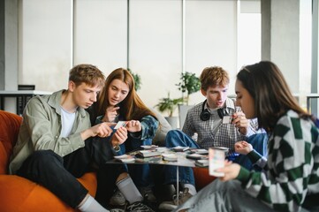 Group of young adults playing game in modern office