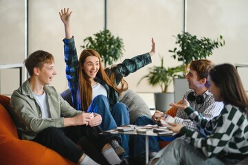 Excited woman winning board game with friends celebrating