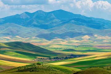 Fototapeta premium Rolling Hills and Distant Mountains Serene Landscape