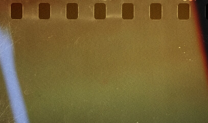 Abstract film strip texture dusty and grungy with light leak suitable for overlay and color cast...