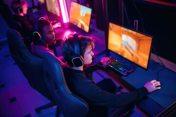 Shooter game. People are playing video game by computers