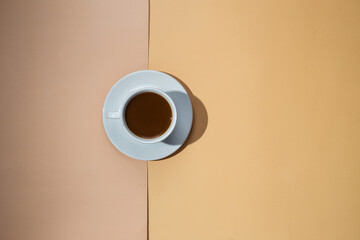 A cup of coffee on a white saucer