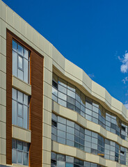 Obraz premium modern office building with blue sky and windows