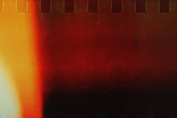 Film stripe black background with red light leaks, broken color tone. Dusty scratched and scanned...