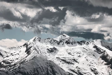 Gordijnen Alpen snow covered peaks and glacier in the italian alps near monte rosa in piedmont area, with cloudy and dramatic sky  © Francesca Emer