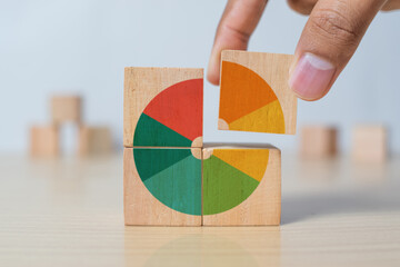 Market share, business opportunity, market growth, increase market share or business concept. Businessman grabs a piece of wooden blocks with pie chart graphic
