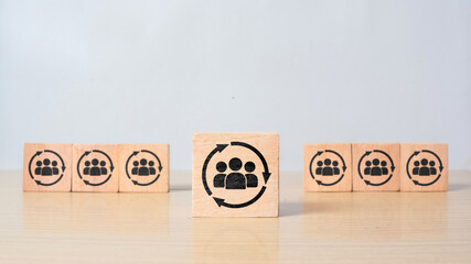 Manpower planning and management concept. Forecasting future staffing needs, analyzing current staffing levels and developing human resource strategies. Wooden cubes with manpower or staffs icons