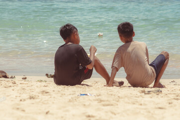 Two boys enjoying a beach vacation