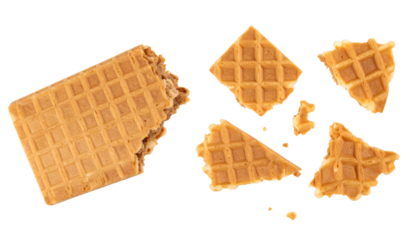 Crispy waffle breaking into crumbles on transparent background
