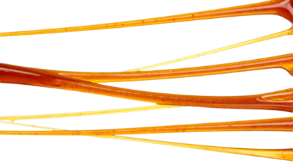 Molasses threads stretching in mid air with a transparent background