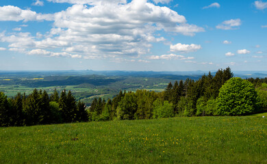 Ridge hiking trail from Javornik to Jested with scenic views into valleys and distant Jizera Mountains. Sunny summer day, peaceful nature and beautiful Czech landscape