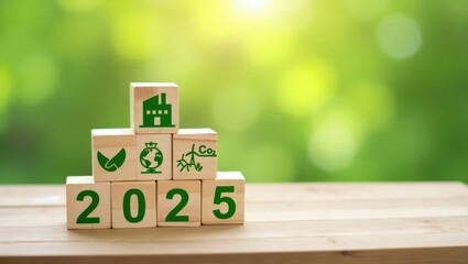 Wooden blocks with 2025 and environmental icons on a table.
