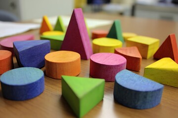 Vibrant kids playing with geometric shape game  
