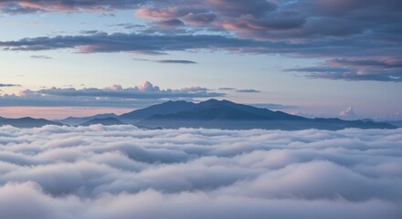 Majestic Mountain Peak Emerging from a Sea of Clouds at Sunrise
