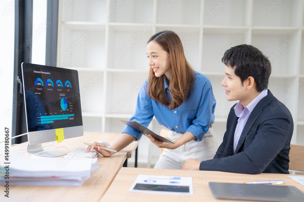 Poster two business professionals engage in data analysis, using a desktop computer and a tablet. they coll