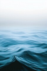 Naklejka premium A minimalist background featuring a cool gradient that fades from turquoise to seafoam green and deep blue.