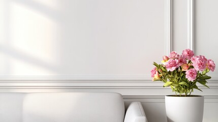 Elegant living room with a white sofa and a vibrant flower arrangement in a minimalist setting