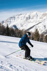 skier in blue jacket skiing down a snowy slope with mountains in the background