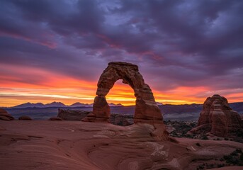 Stunning view of delicate arch at sunset, showcasing vibrant colors in the desert landscape of Utah.