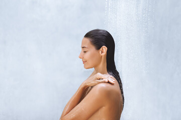 Serene Woman Enjoying a Relaxing Shower With Eyes Closed