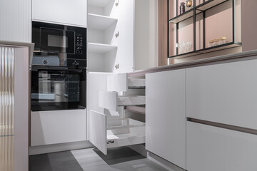 stylish modern built-in kitchen with upper and lower cabinets, drawers, shelves. kitchen facades...