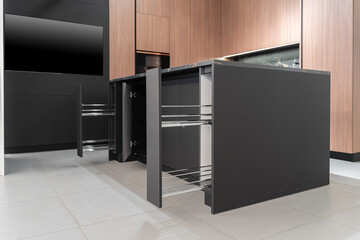 modern huge built-in kitchen with upper and lower cabinets, shelves, drawers. wooden and gray...