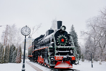 Old train in railway station in winter day
