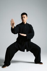 arafed man in black shirt doing a taido pose