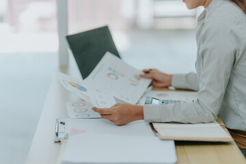 Businesswoman Analyzing Financial Data Charts