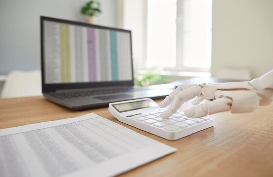 Robotic hand, mechanical arm counting on calculator, accounting machining processes, laptop screen checking stock market data, AI-powered accounting software trading stocks information for growth