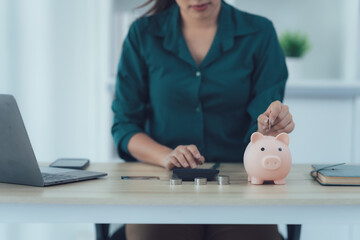Woman Saving Money with Piggy Bank