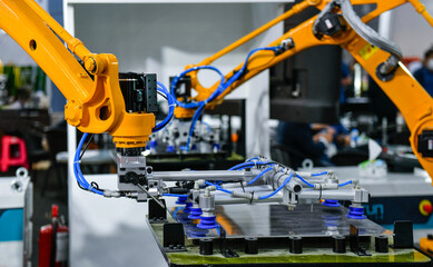 Robot arm control the Steel sheet cutting process in the industrial factory