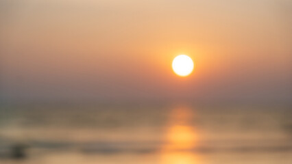 Abstract blur tropical sea beach with sunset sky background.