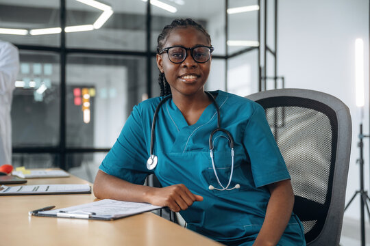 In the office clinic. Female doctor in coat