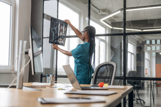 Female doctor in coat is in the office clinic
