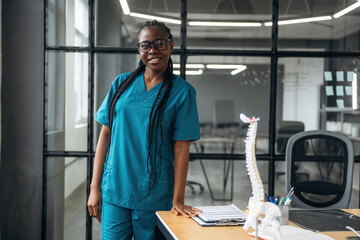 In the office clinic. Female doctor in coat