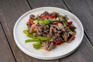 chicken gizzard in chinese style oyster sauce with green and red bell pepper