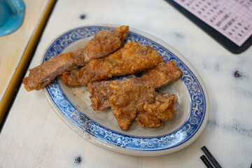 famous crispy pork chop in corn and potato starch breading