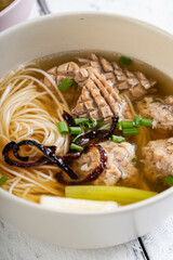 pork kidney and pork meatball in clear noodle soup