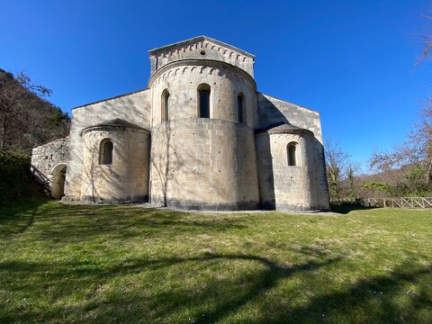 San Liberatore a Maiella Abbey standing on a green lawn in a sunny day, near Serramonacesca, Abruzzo, Italy