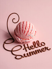 Hello Summer chocolate text and perfectly sculpted scoop of ice cream with sprinkles on pastel pink background.