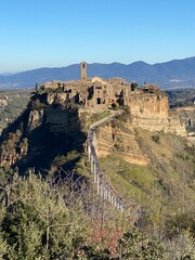 Footbridge leading to Civita di Bagnoregio, a small hill town in the Province of Viterbo, Lazio,...