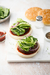 Homemade beef burger with cucumber salad